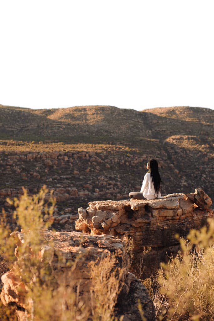 Woman Meditating In Nature At Bliss And Stars Wilderness Retreat