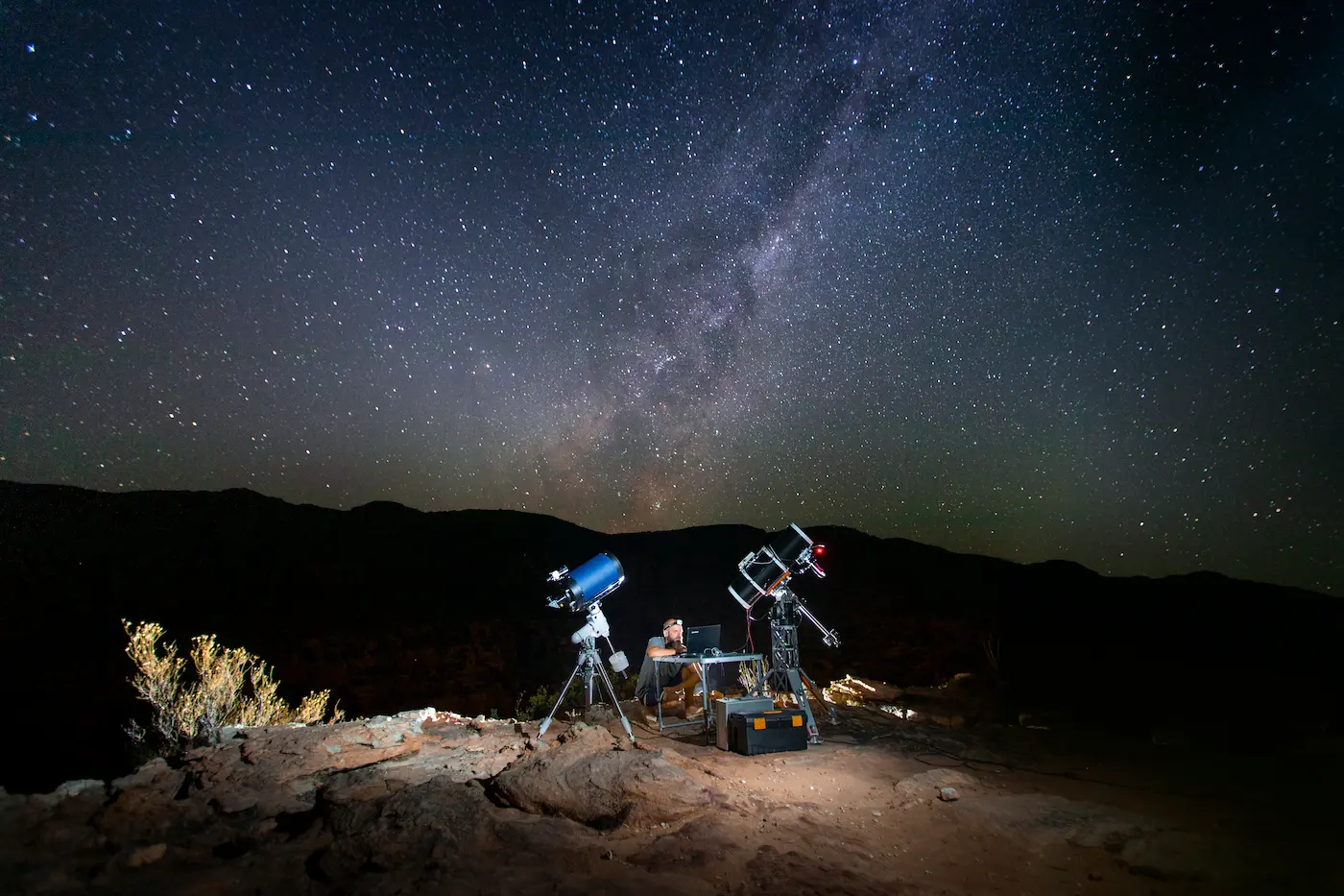 Astronomy equipment and telescopes set up under the Milky Way at Bliss and Stars off-grid retreat, Cederberg Mountains, South Africa