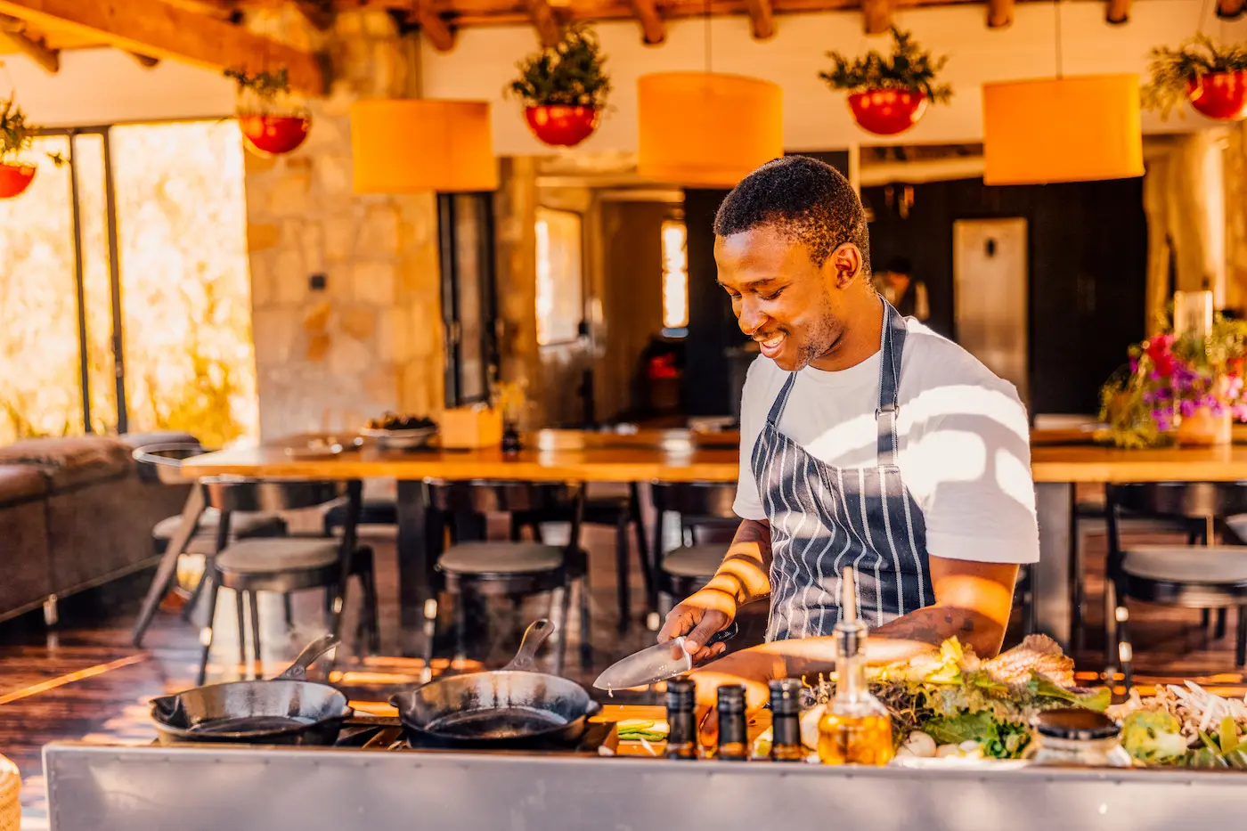 Chef preparing seasonal ingredients at the open kitchen, Bliss and Stars cooking retreat, Cederberg