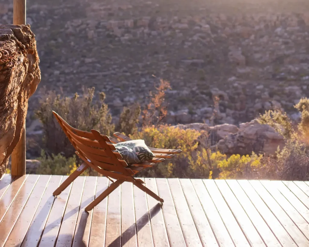 Wooden lounger on a private chalet deck overlooking the Cederberg mountain landscape, Bliss & Stars retreat, Western Cape